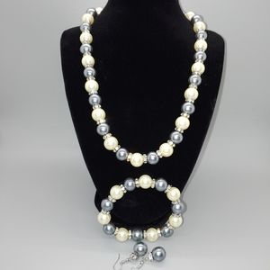 Matching necklace, bracelet, and earrings set